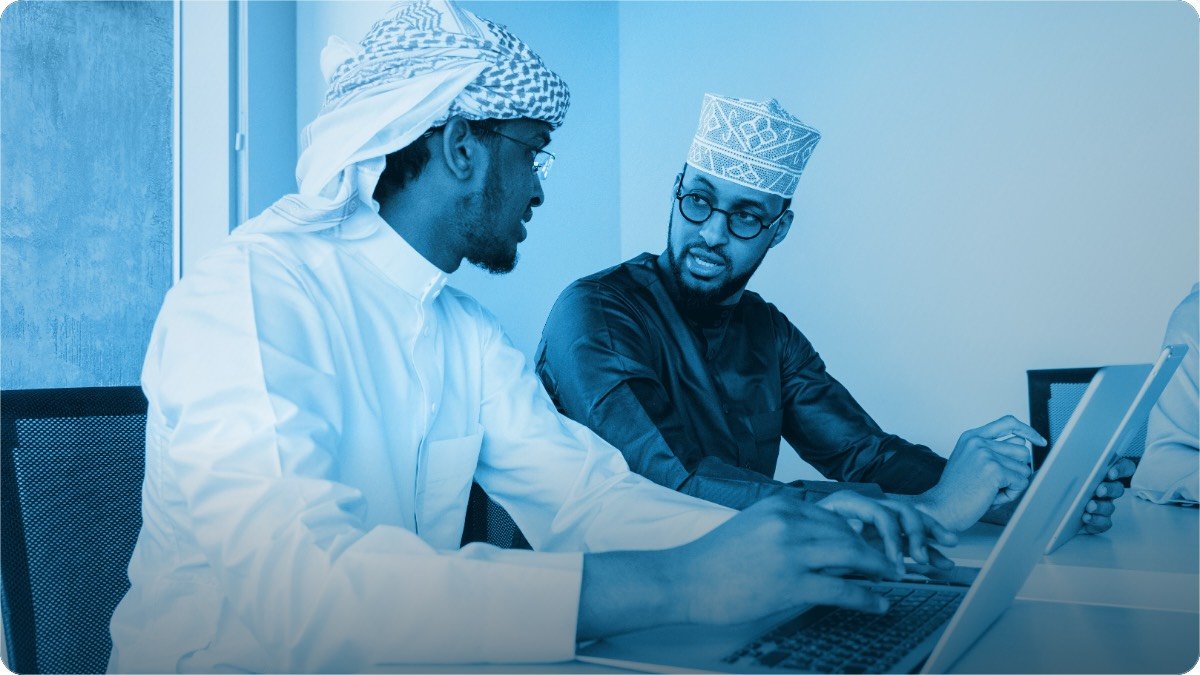 Two partners sitting together and going through the month's figures.